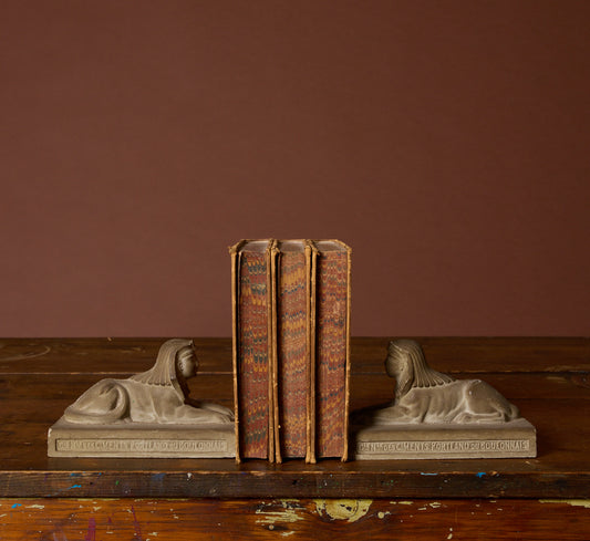 PAIR OF CAST STONE SPHINX BOOKENDS