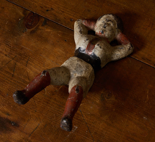 19TH CENTURY CAST IRON PAINTED "NAUGHTY NELLIE" FIGURINE