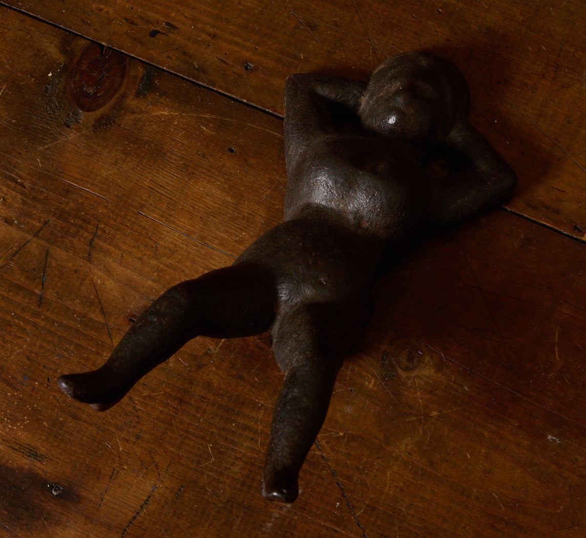 19TH CENTURY CAST IRON "NAUGHTY NELLIE" FIGURINE
