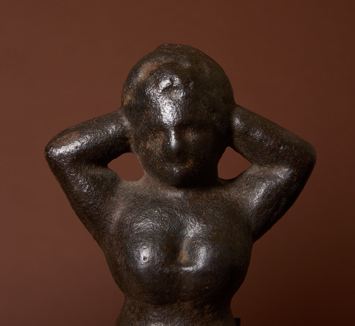 19TH CENTURY CAST IRON "NAUGHTY NELLIE" FIGURINE